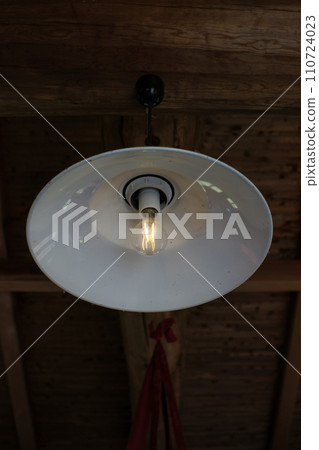 Retro and stylish lighting with a white umbrella 110724023