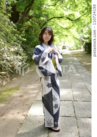 Portrait of a young woman wearing a yukata 110724199