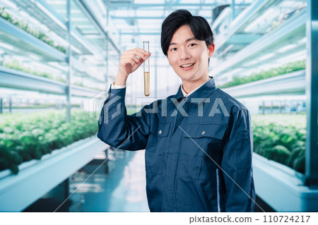 Engineers researching pesticides in work clothes 110724217