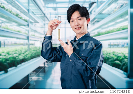 Engineers researching pesticides in work clothes Engineers researching pesticides in work clothes 110724218