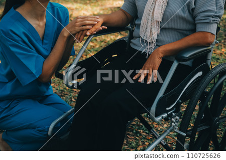 Young asian caretaker with 60s asia elderly woman consulting and encourage, take a history and recommend the right treatment to live happily in retirement, holding hands and encouraging Young asian caretaker with 60s asia elderly woman consulting and encourage, take a history and recommend the right treatment to live happily in retirement, holding hands and encouraging 110725626