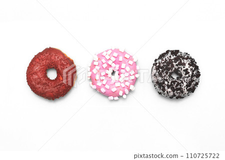Delicious donuts on white background Delicious donuts on white background 110725722