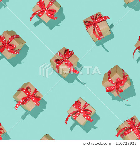 Seamless square pattern with gift boxes with red bows on mint background 110725925