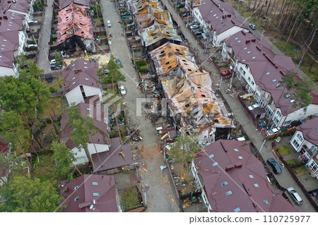 Hostomel, Kyev region Ukraine - 09.04.2022: Top view of the destroyed and burnt houses. Houses were destroyed by rockets or mines from Russian soldiers. Cities of Ukraine after the Russian occupation. Hostomel, Kyev region Ukraine - 09.04.2022: Top view of the destroyed and burnt houses. Houses were destroyed by rockets or mines from Russian soldiers. Cities of Ukraine after the Russian occupation. 110725977