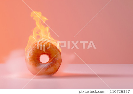 Burning sweet donut, doughnut on fire. Hot baked roll in flames, junk food, burning calories, weight loss and healthy diet concept. Burn fat, fit motivation, discipline, regime, healthy food choices 110726357