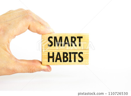 Smart habits symbol. Concept words Smart habits on wooden blocks. Beautiful white table white background. Businessman hand. Business and smart habits concept. Copy space. 110726530