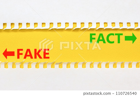 Fact or fake symbol. Concept word Fake and Fact on beautiful yellow paper. Beautiful white paper background. Business and fact or fake concept. Copy space. Fact or fake symbol. Concept word Fake and Fact on beautiful yellow paper. Beautiful white paper background. Business and fact or fake concept. Copy space. 110726540