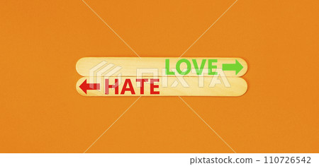 Love or hate symbol. Concept word Love or Hate on beautiful wooden stick. Beautiful orange table orange background. Business and love or hate concept. Copy space. Love or hate symbol. Concept word Love or Hate on beautiful wooden stick. Beautiful orange table orange background. Business and love or hate concept. Copy space. 110726542