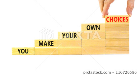 You make your own choice symbol. Concept words You make your own choice on wood blocks. Beautiful white table white background. Businessman hand. Business you make your own choice concept. Copy space. 110726586