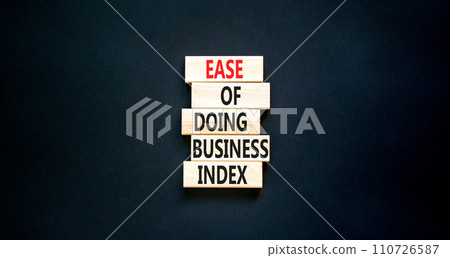 Ease of doing business index symbol. Concept words Ease of doing business index on wooden blocks. Beautiful black table black background. Business, ease of doing business index concept. Copy space. Ease of doing business index symbol. Concept words Ease of doing business index on wooden blocks. Beautiful black table black background. Business, ease of doing business index concept. Copy space. 110726587