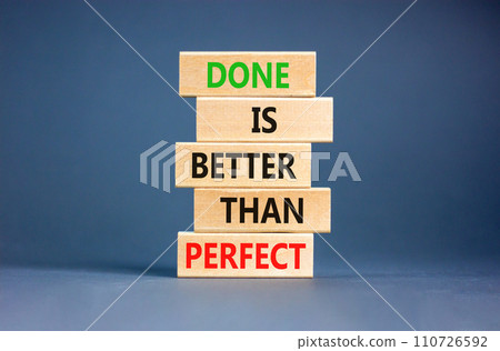 Done is better than perfect symbol. Concept words Done is better than perfect on wooden blocks. Beautiful grey table grey background. Business, done is better than perfect concept. Copy space. 110726592