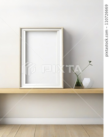 Blank picture frame on bookshelf in modern room. Blank picture frame on bookshelf in modern room. 110726669