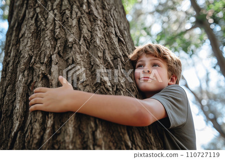 Green Connection: Teen Embracing a Tree in Harmony 110727119
