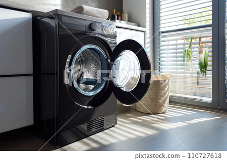 Modern Parquet Laundry: Close-up of Stylish Washing Machine Modern Parquet Laundry: Close-up of Stylish Washing Machine 110727618
