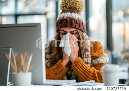 Winter Ailment: Business Lady in Hat Coping with Cold in the Office 110727739