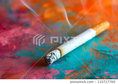 Smashed Cigarette Butt Against Colored Canvas 110727769