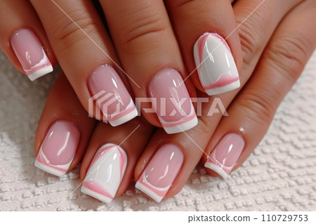 Close-up of delicate female manicure in pink tones 110729753