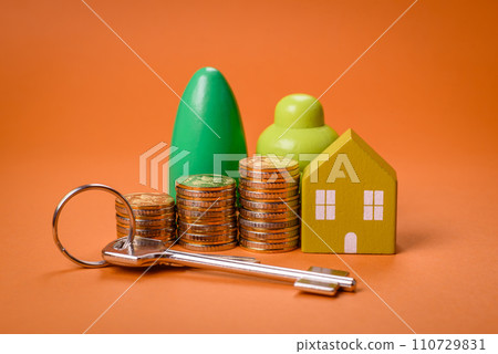 A small wooden house and keys as an idea for investing in your own home 110729831