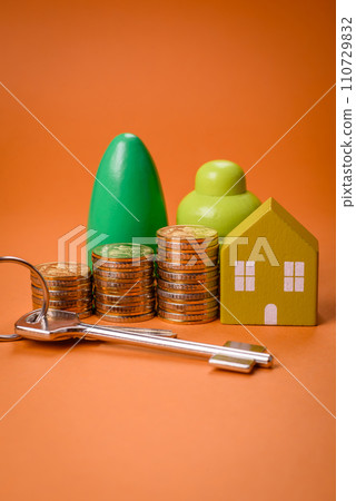 A small wooden house and keys as an idea for investing in your own home A small wooden house and keys as an idea for investing in your own home 110729832