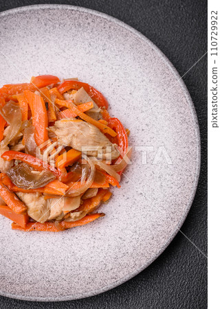 Delicious fresh stew with chicken or turkey with slices of sweet pepper and carrots 110729922