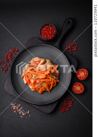 Delicious fresh stew with chicken or turkey with slices of sweet pepper and carrots 110729941