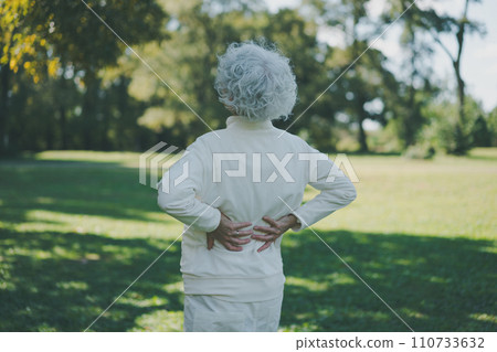 Senior with back pain after exercising 110733632