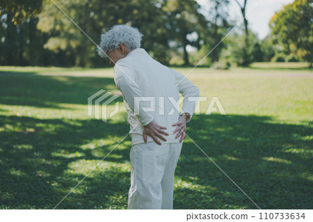 Senior with lower back pain after exercising 110733634
