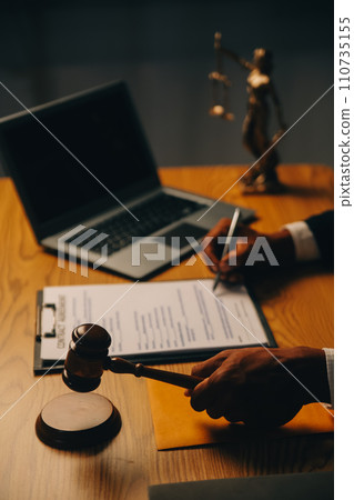 Judge gavel with Justice lawyers having team meeting at law firm background. Concepts of Law and Legal services. Judge gavel with Justice lawyers having team meeting at law firm background. Concepts of Law and Legal services. 110735155