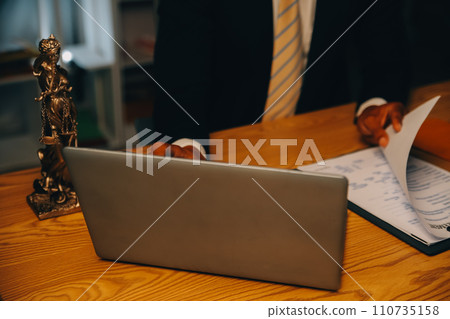 Judge gavel with Justice lawyers having team meeting at law firm background. Concepts of Law and Legal services. Judge gavel with Justice lawyers having team meeting at law firm background. Concepts of Law and Legal services. 110735158