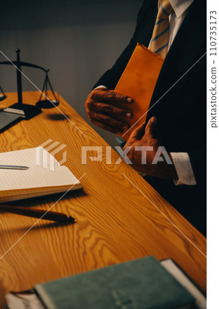 Judge gavel with Justice lawyers having team meeting at law firm background. Concepts of Law and Legal services. 110735173
