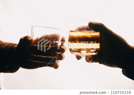 Whiskey splashing out of glass, isolated on white background 110735239