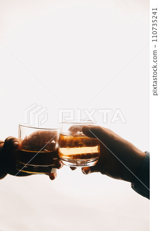 Whiskey splashing out of glass, isolated on white background 110735241