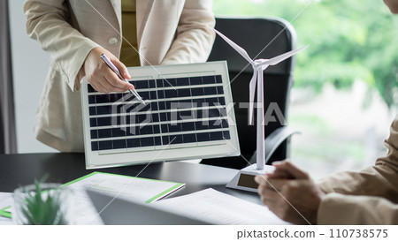 Alternative energy environment businesspeople explaining solar cell panel of power future project 110738575