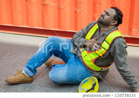 Heart attack chest pain expression. Hispanic indian fat male worker industry engineer staff accident fall down injury emergency need medical 110739233