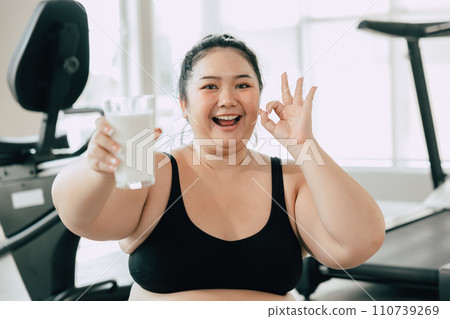 sport healthy fat women happy smiling enjoy drink milk and diet exercise activity in fitness sport club sport healthy fat women happy smiling enjoy drink milk and diet exercise activity in fitness sport club 110739269