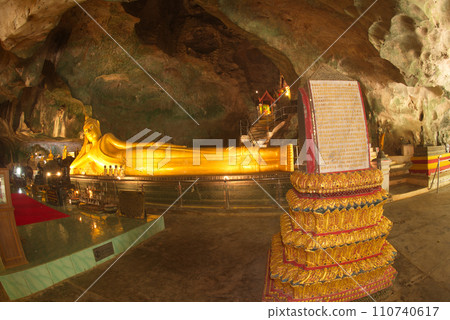 The golden reclining Buddha image is 14 meters long with perfect beauty at Wat Tham Suwan Khuha or Golden cave. This is a popular place for both Thai and foreign tourists. The golden reclining Buddha image is 14 meters long with perfect beauty at Wat Tham Suwan Khuha or Golden cave. This is a popular place for both Thai and foreign tourists. 110740617