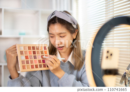 Beauty blogger, Woman teaching how to apply makeup, Recommended cosmetics, Record vlog streaming video. Beauty blogger, Woman teaching how to apply makeup, Recommended cosmetics, Record vlog streaming video. 110741665