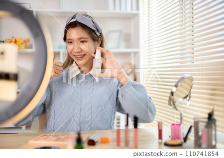 Beauty blogger, Woman teaching how to apply makeup, Recommended cosmetics, Record vlog streaming video. Beauty blogger, Woman teaching how to apply makeup, Recommended cosmetics, Record vlog streaming video. 110741854