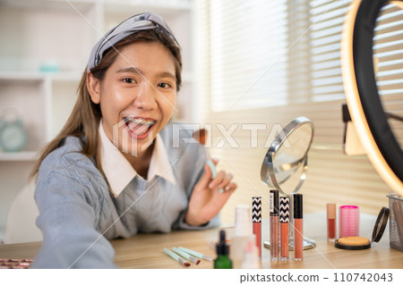 Say hi, Selfie Video, call greetings via mobile phone, Woman teaching makeup, Beauty blogger, Record vlog streaming video. Say hi, Selfie Video, call greetings via mobile phone, Woman teaching makeup, Beauty blogger, Record vlog streaming video. 110742043