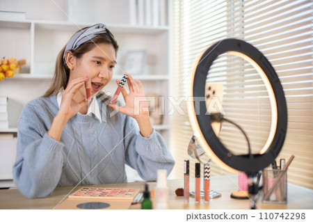 Beauty blogger, Woman teaching how to apply makeup, Recommended cosmetics, Record vlog streaming video. Beauty blogger, Woman teaching how to apply makeup, Recommended cosmetics, Record vlog streaming video. 110742298