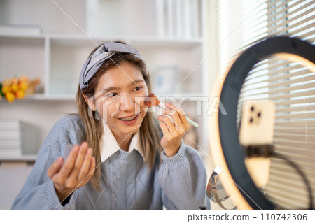 Beauty blogger, Woman teaching how to apply makeup, Recommended cosmetics, Record vlog streaming video. Beauty blogger, Woman teaching how to apply makeup, Recommended cosmetics, Record vlog streaming video. 110742306