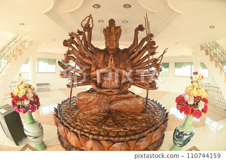 The goddess Guanyin is carved from a large piece of fragrant sandalwood. Inside in Phop Chok ThamaChedi Phra Maha Chedi at Wat Huay Pla Kang temple. The goddess Guanyin is carved from a large piece of fragrant sandalwood. Inside in Phop Chok ThamaChedi Phra Maha Chedi at Wat Huay Pla Kang temple. 110744159