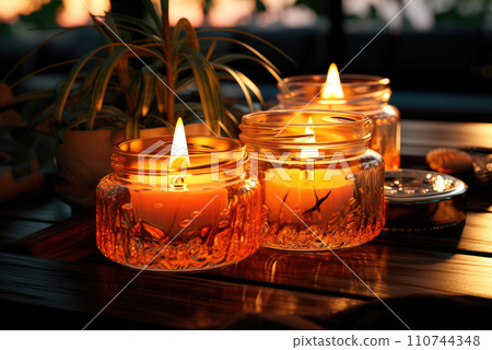 Beautiful burning candles on wooden table 110744348