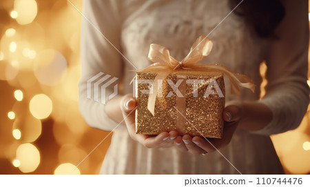 A woman receiving a present 110744476