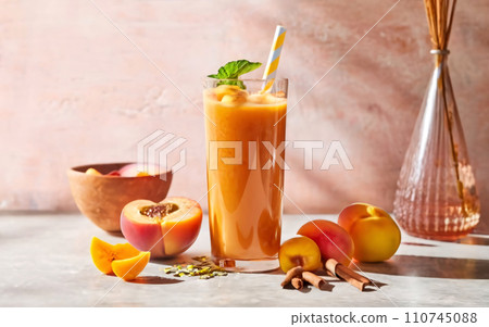 AI-generated content. a table topped with a tall glass of orange juice 110745088
