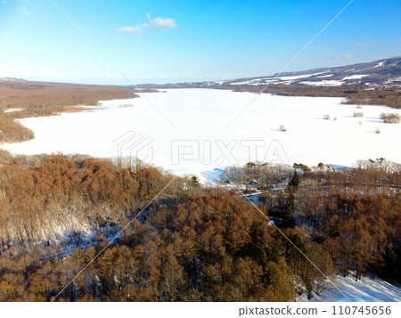 Photographing the snowy landscape of Onuma Quasi-National Park in Nanae Town, Hokkaido in winter 110745656