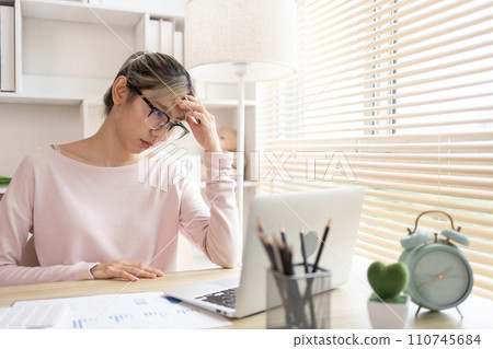 Stressed Businesswoman Facing Financial Loss in Corporate Office, Depressed man Dealing with Financial Setback, Stress and Money Problems, Anxiety and Worry Concept. 110745684
