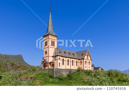 Vagan Kirke's unique architecture stands out amid greenery and mountains in Lofoten Vagan Kirke's unique architecture stands out amid greenery and mountains in Lofoten 110745916
