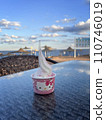ice cream in pink cup on the table with sea view on background 110746019