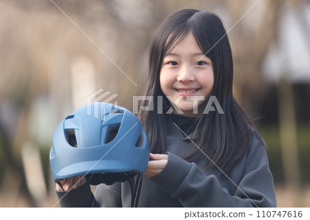 girl with bicycle helmet girl with bicycle helmet 110747616